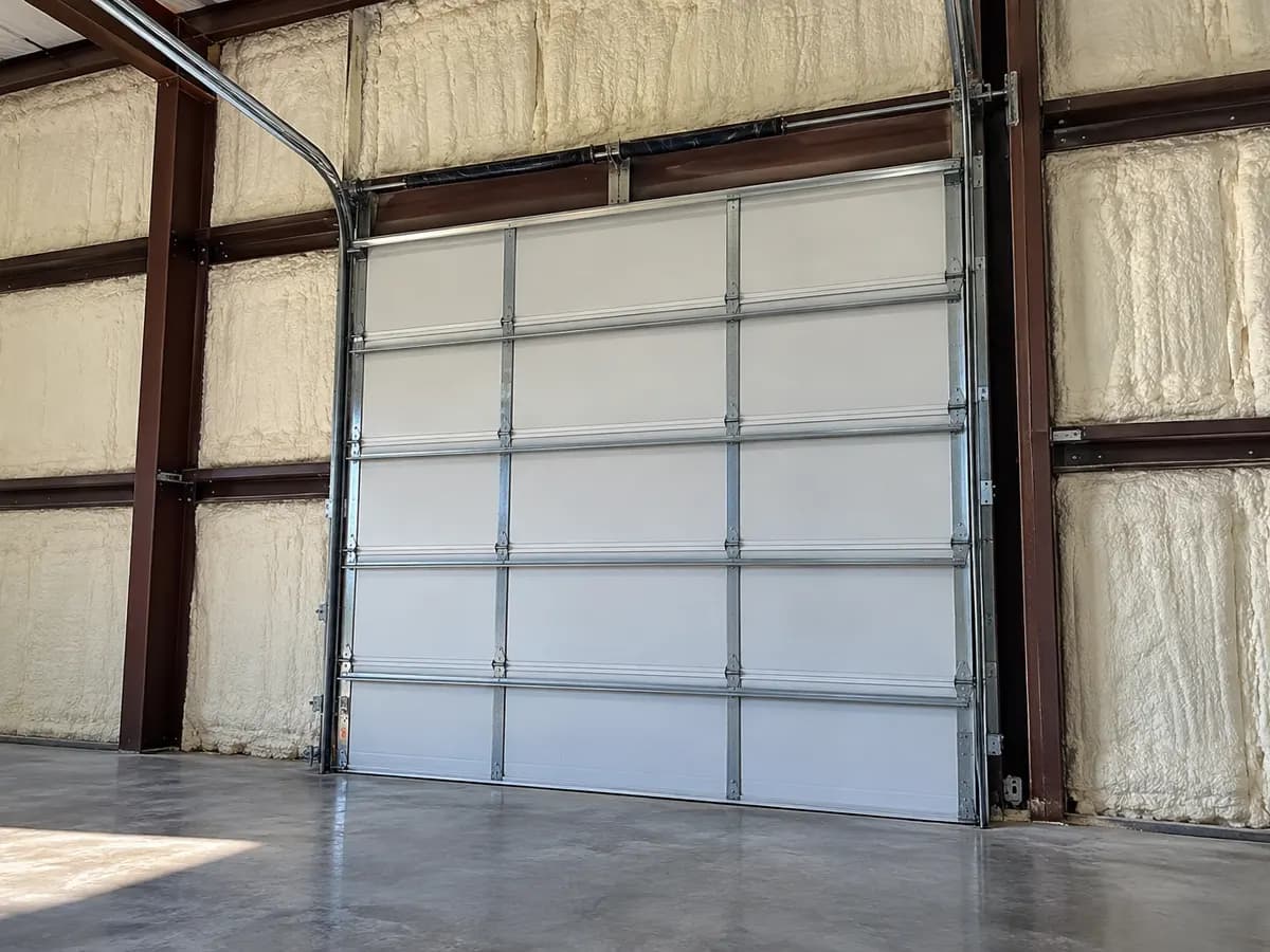 Illustration of a loading-door framing transition beside selected insulated metal panels