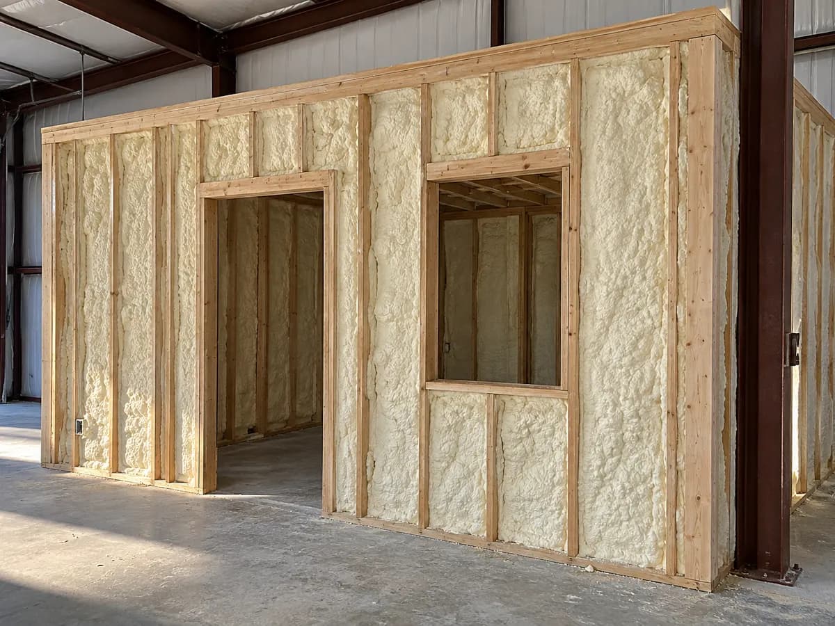Illustration of a partly insulated office partition within a larger steel building shell