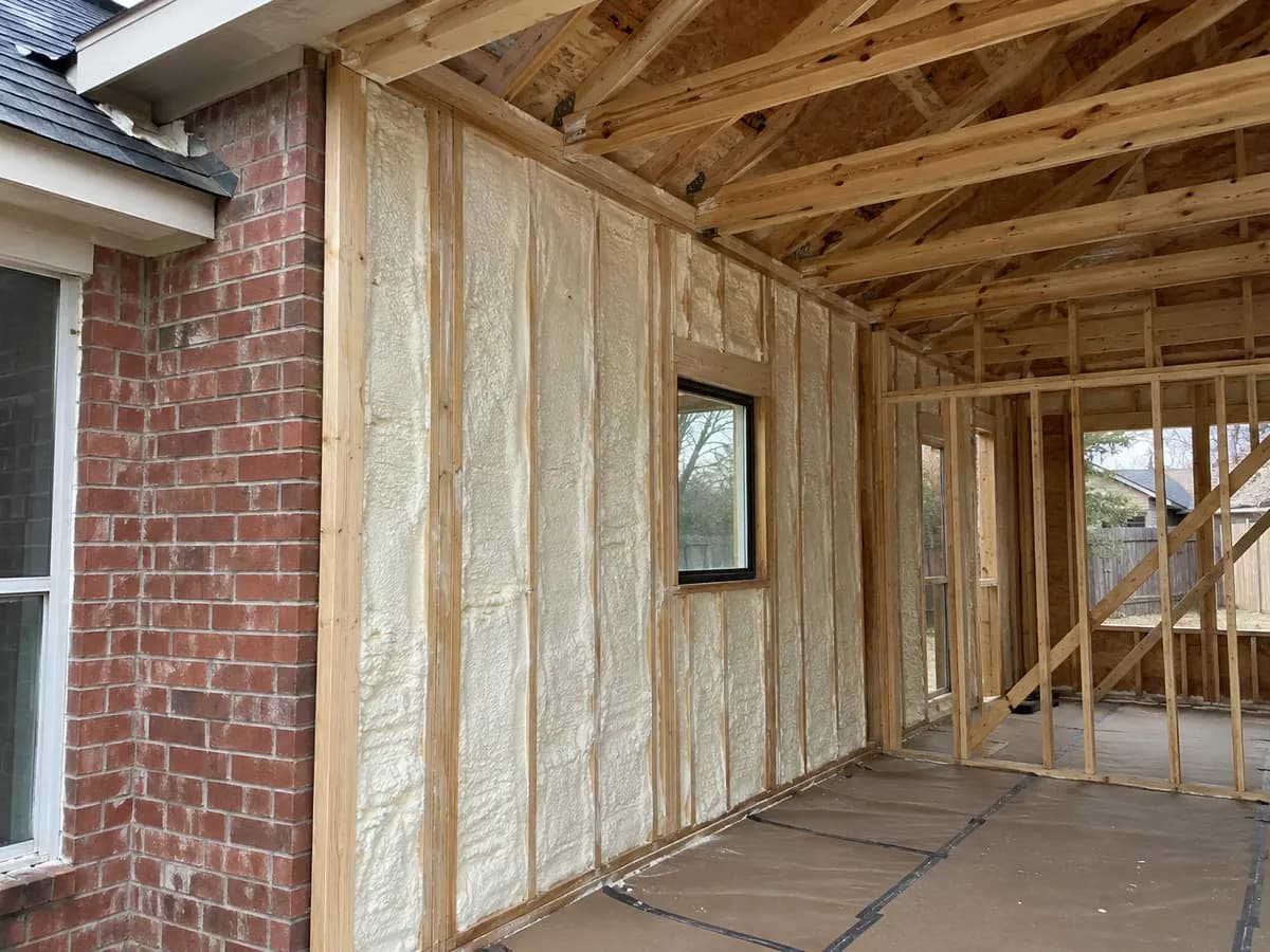 Illustration of a timber-framed addition connecting to an existing brick exterior wall