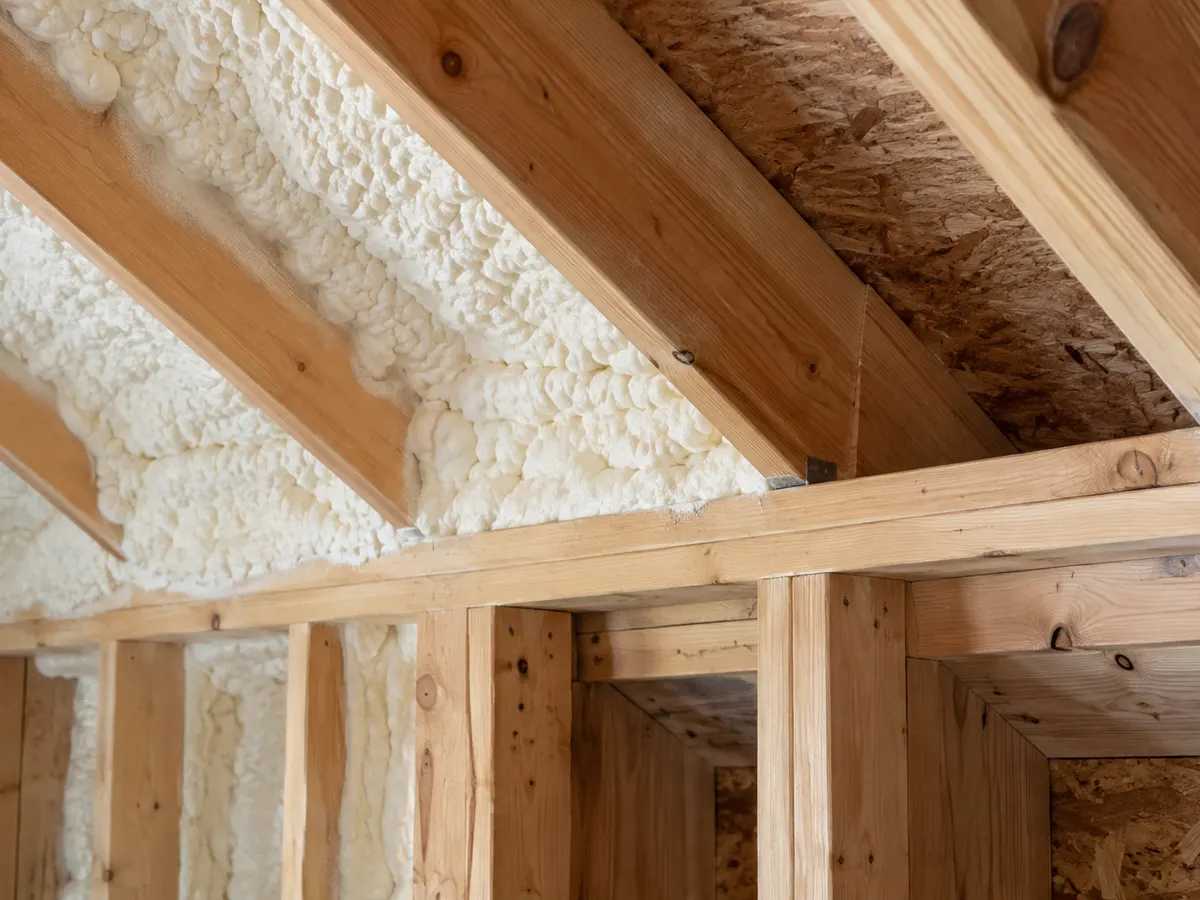 Illustration of a new-build wall-to-roof junction with visible framing transitions