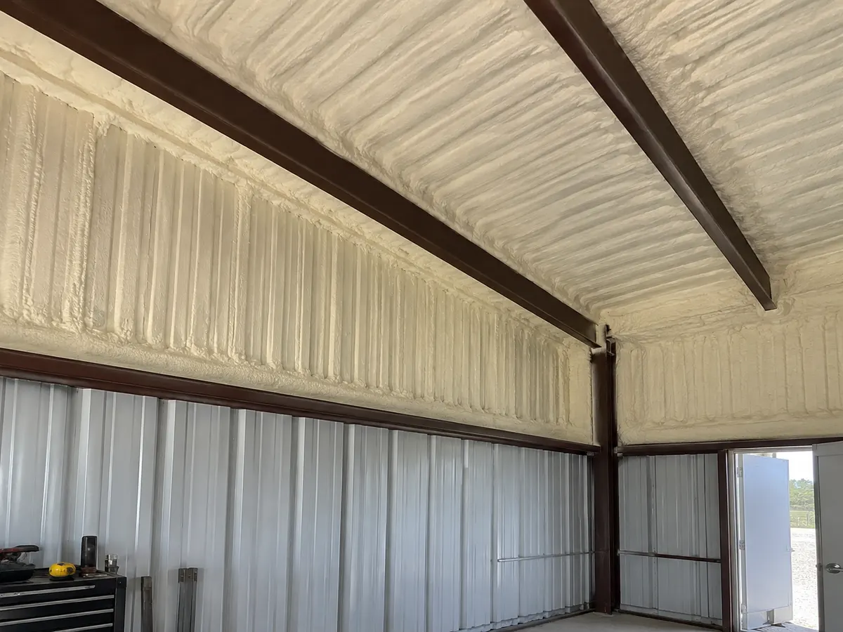 Illustration of a steel workshop roof-to-wall junction with selected foam coverage