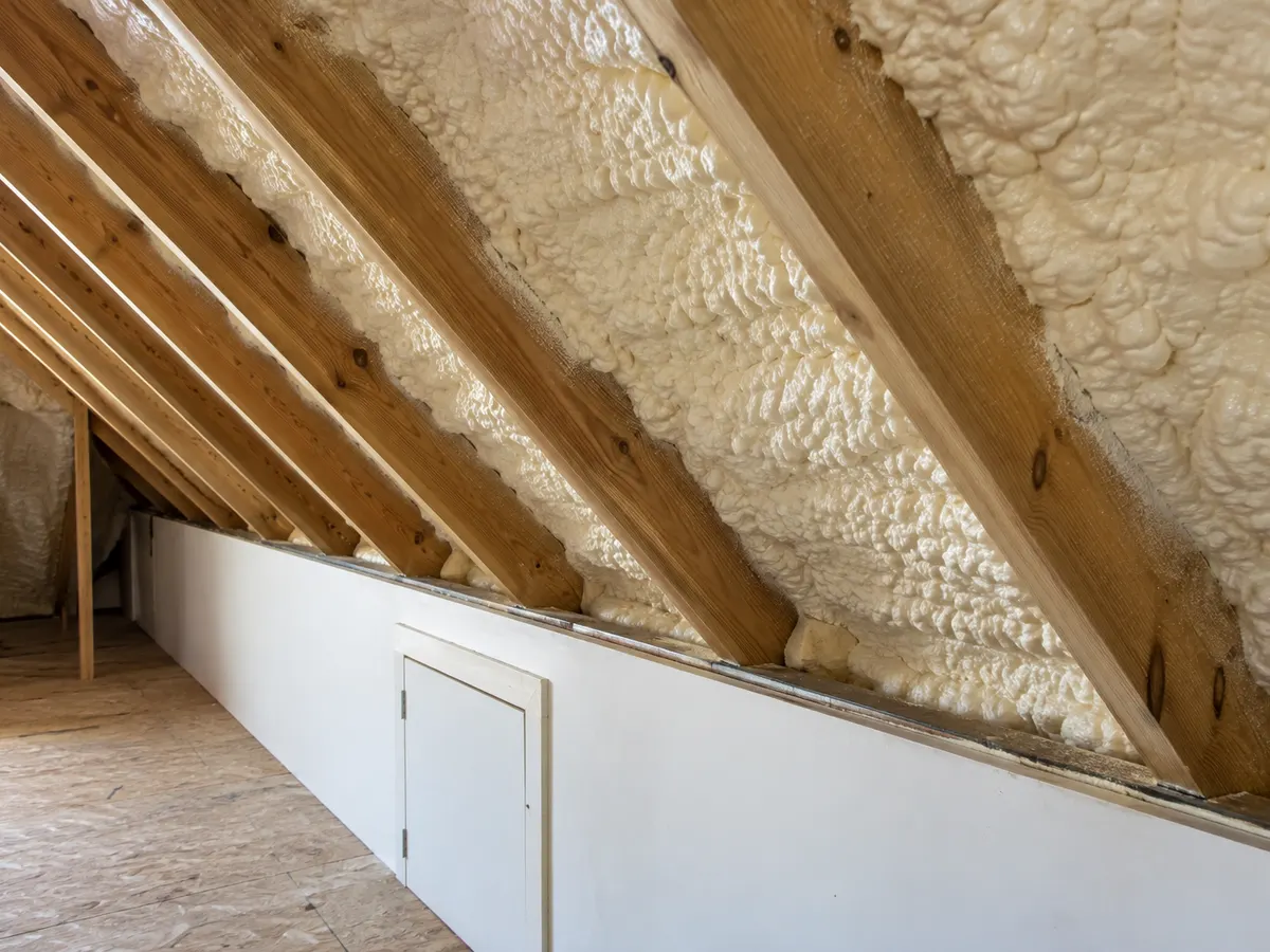 Illustration of a knee-wall access opening beside selected insulated sloped roof bays