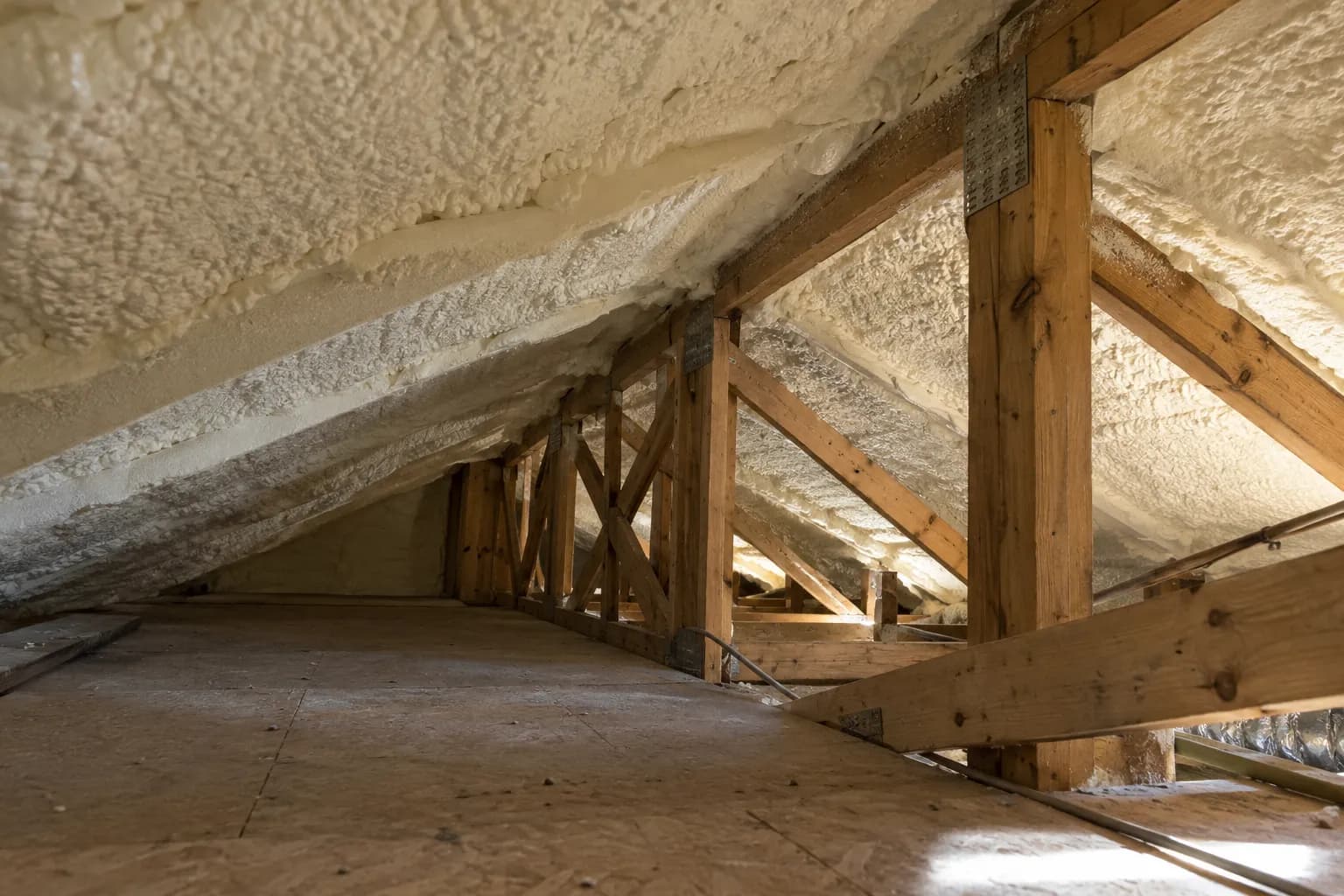 Illustration of low existing house attic with white foam roof and several ceiling transitions, aged dry wood and afternoon side light